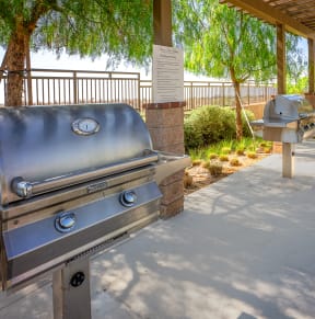 two bbq grills at the whispering winds apartments in pearland, tx