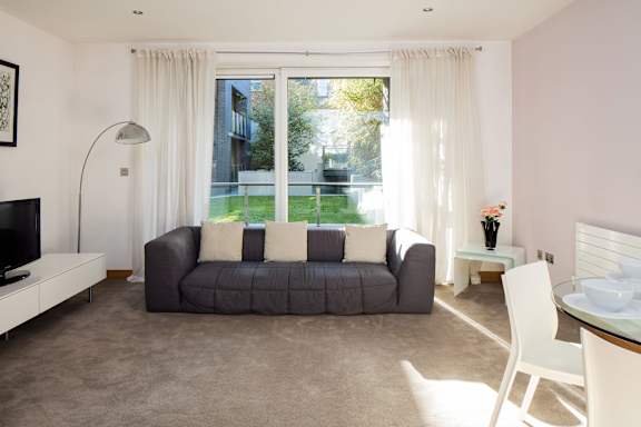 a living room with a couch and a window