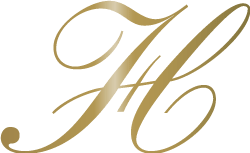 A stylized gold letter "J" on a green background.