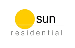 a yellow circle with the words residential on a black background