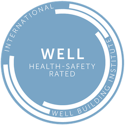 a blue circle with the words well health safety rated on it