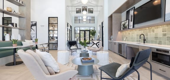 a living room filled with furniture and a large window
