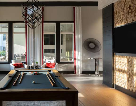 Drift Town Center East game room with shuffleboard and billiards