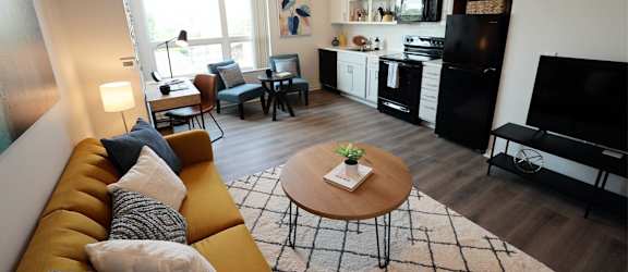 a living room with a couch and a table