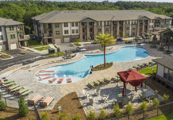 Aerial view of the resort-style swimming pool, sundeck, and poolside cabana at The Retreat at Fairhope Village