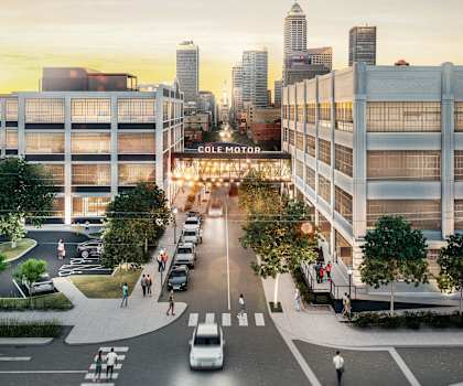 A rendering of a city street with a Cole Motor building in the background.