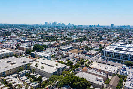 A cityscape with a mix of residential and commercial buildings.