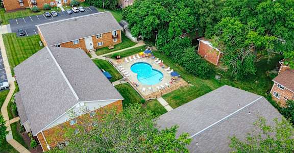 an aerial view of a house with a swimming pool