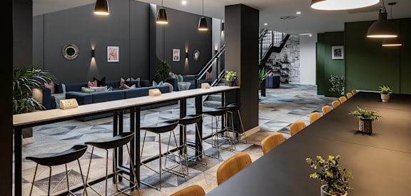 a restaurant with tables and chairs and a bar