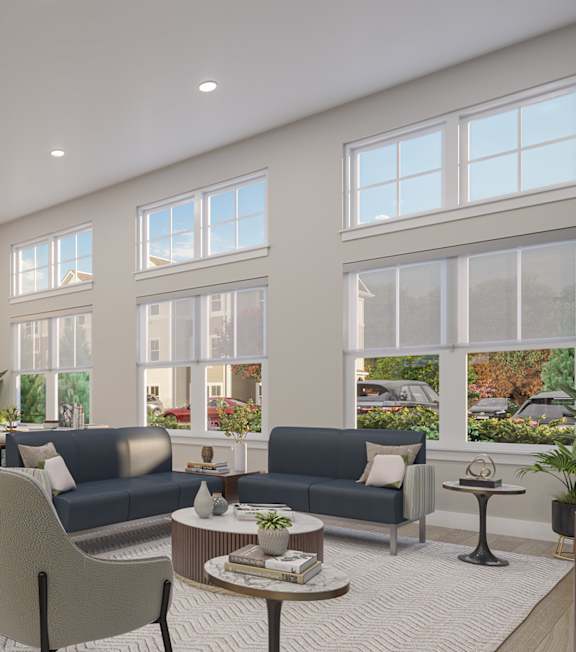 A modern living room with a large window and a view of a street.