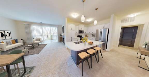 a kitchen and living room with a white counter top