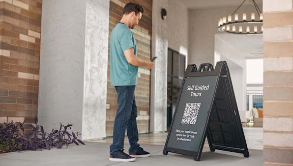 A mobile phone displaying a real estate listing for Wishire La Brea Apartments.