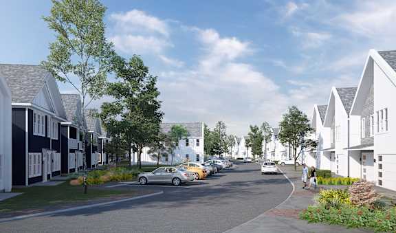A street view of a residential area with cars parked on the side of the road.