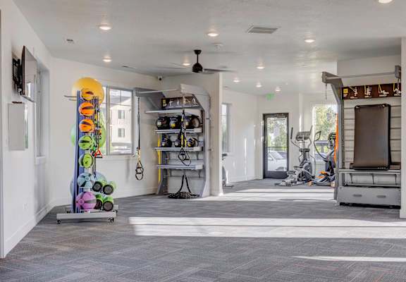 the gym at the district flats apartments in lenexa