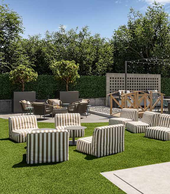 A large outdoor seating area with multiple striped chairs and tables.
