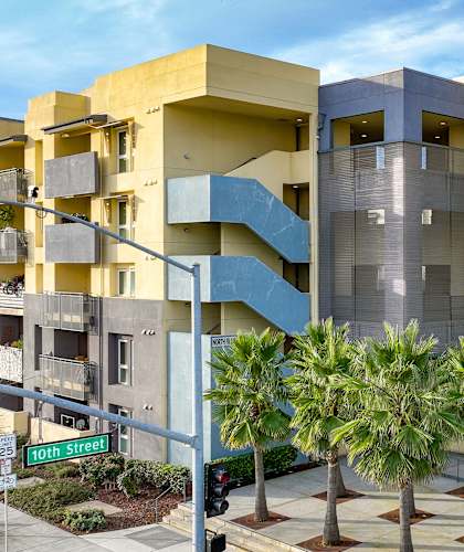 a building with palm trees in front of it