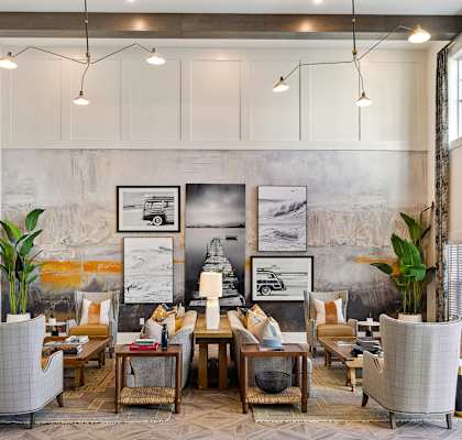 A living room with a grey sofa and a coffee table.