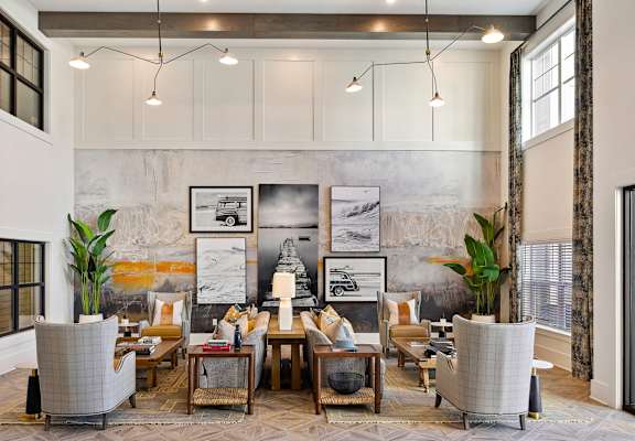 A living room with a grey sofa and a coffee table.