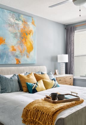 a bedroom with a bed and a painting on the wall at The District at Rosemary, Sarasota, FL, 34236