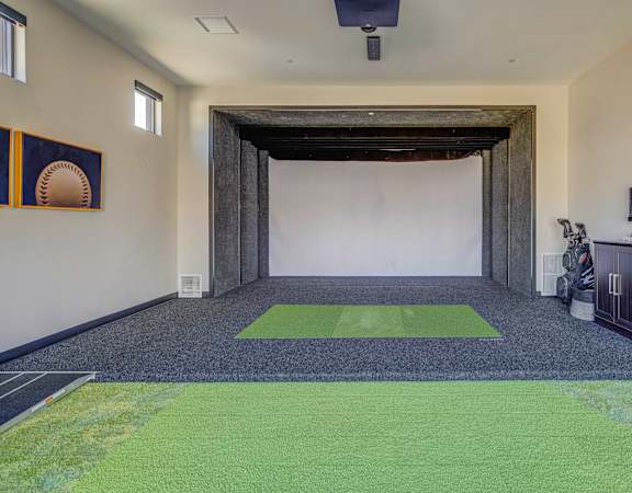 a room with a carpeted floor and a white wall