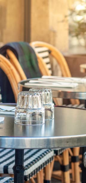 a row of tables and chairs at a restaurant