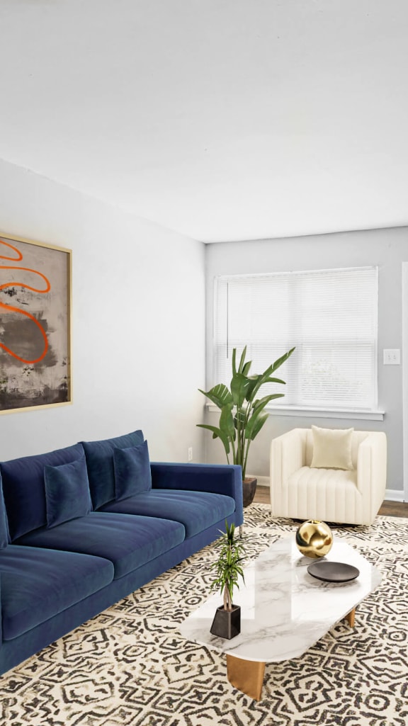 a living room with a blue couch and a coffee table