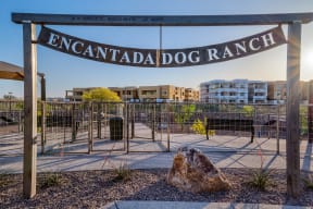 a large rock sits in front of a fence with the words ``encantada dog ranch