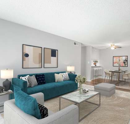 a living room with a blue couch at Lakes Edge Apartments, Greensboro, NC, 27409