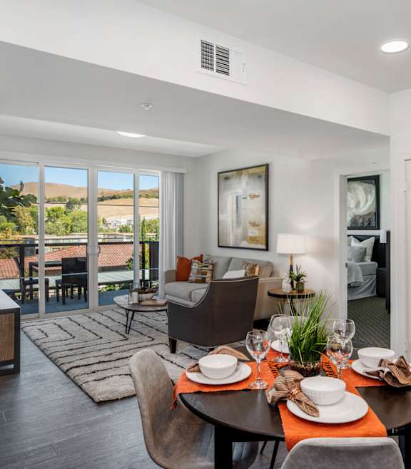 YOLO East dining table and furnished living room