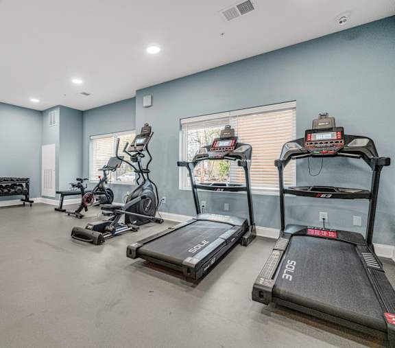 A spacious room with treadmills and other exercise equipment.at Park Lamont Apartments & Townhomes, Ohio