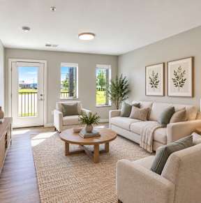 A living room with a television, couch, and a coffee table.