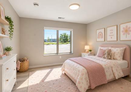 A bedroom with a large bed and a painting on the wall.