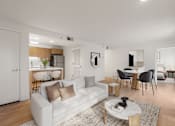 Thumbnail 6 of 29 - A modern living room with a white couch and a coffee table. at AVIA Lofts on Parkway, Vancouver, WA