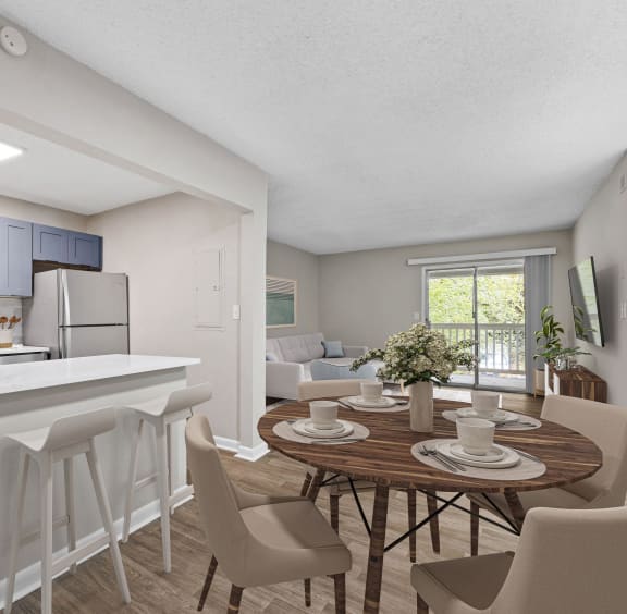 an open kitchen and dining area with a dining table and chairs