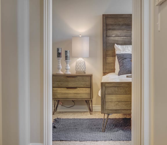 a bedroom with a bed and a nightstand