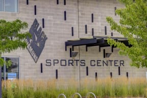 a building with a sports center sign on the side of it