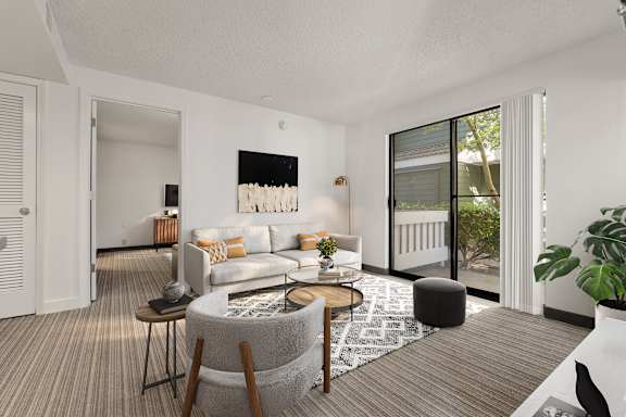 A modern living room with a grey sofa and a coffee table. at AVIA Lofts on Parkway, Vancouver, 98662