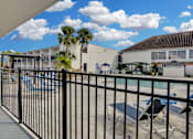 Thumbnail 1 of 26 - Poolside Relaxation Area at Avia Apartments at Reedy Creek, Kissimmee, FL, 34747