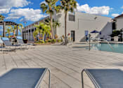 Thumbnail 6 of 26 - Poolside Seating Area at Avia Apartments at Reedy Creek, Florida