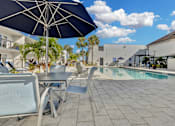 Thumbnail 7 of 26 - Poolside Lounge Space at Avia Apartments at Reedy Creek, Kissimmee