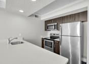 Thumbnail 10 of 12 - Functional Kitchen at Avia Apartments at Reedy Creek, Kissimmee, Florida