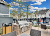 Thumbnail 20 of 47 - the preserve at ballantyne commons furnished patio with barbecue grill and tables and chairs