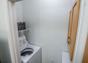 Thumbnail 11 of 18 - View of the laundry closet in the model home at Harbour Breeze Apartments in Suffolk Virginia