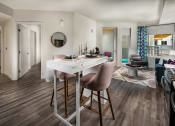Thumbnail 18 of 27 - Kitchen table and chairs with views into the livingroom