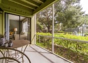 Thumbnail 14 of 27 - Screened in Patio at Laurel Oaks Apartments in Tampa, FL
