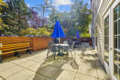 Thumbnail 5 of 7 - a patio with tables and chairs and umbrellas