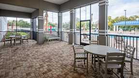 A patio with a table and chairs is shown.