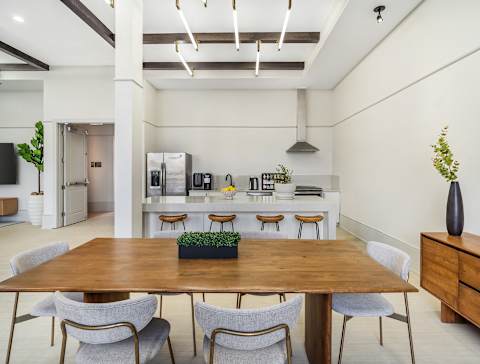 A dining room with a wooden table and chairs at The Addison,Louisiana