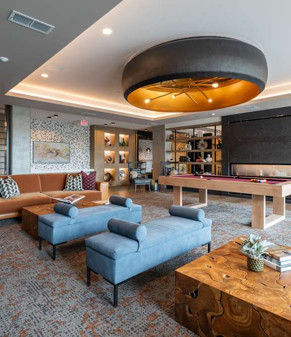 a living room filled with furniture and a large window