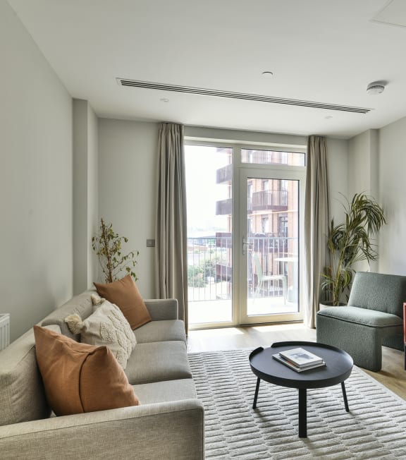 a living room with a couch and a table